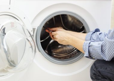 handyman repairing a washing machine
